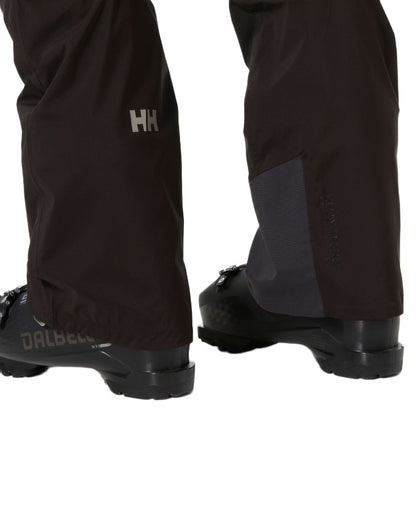 Black Coloured Helly Hansen Mens Legendary Insulated Ski Pants on white background 