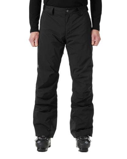 Black Coloured Helly Hansen Mens Legendary Insulated Ski Pants on white background 