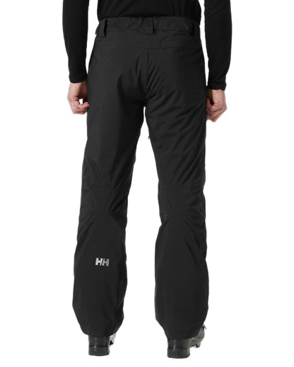 Black Coloured Helly Hansen Mens Legendary Insulated Ski Pants on white background 