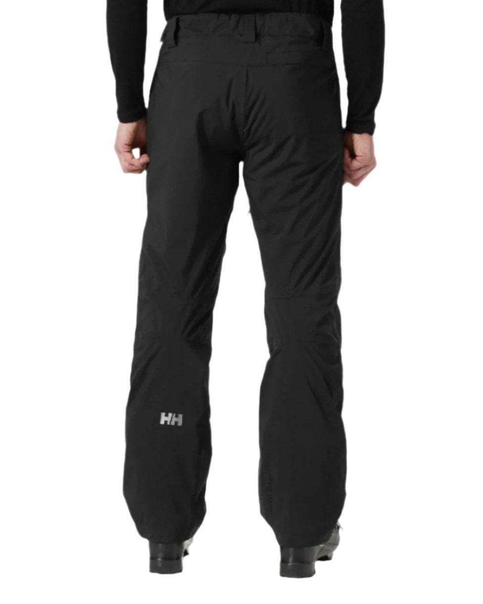 Black Coloured Helly Hansen Mens Legendary Insulated Ski Pants on white background 