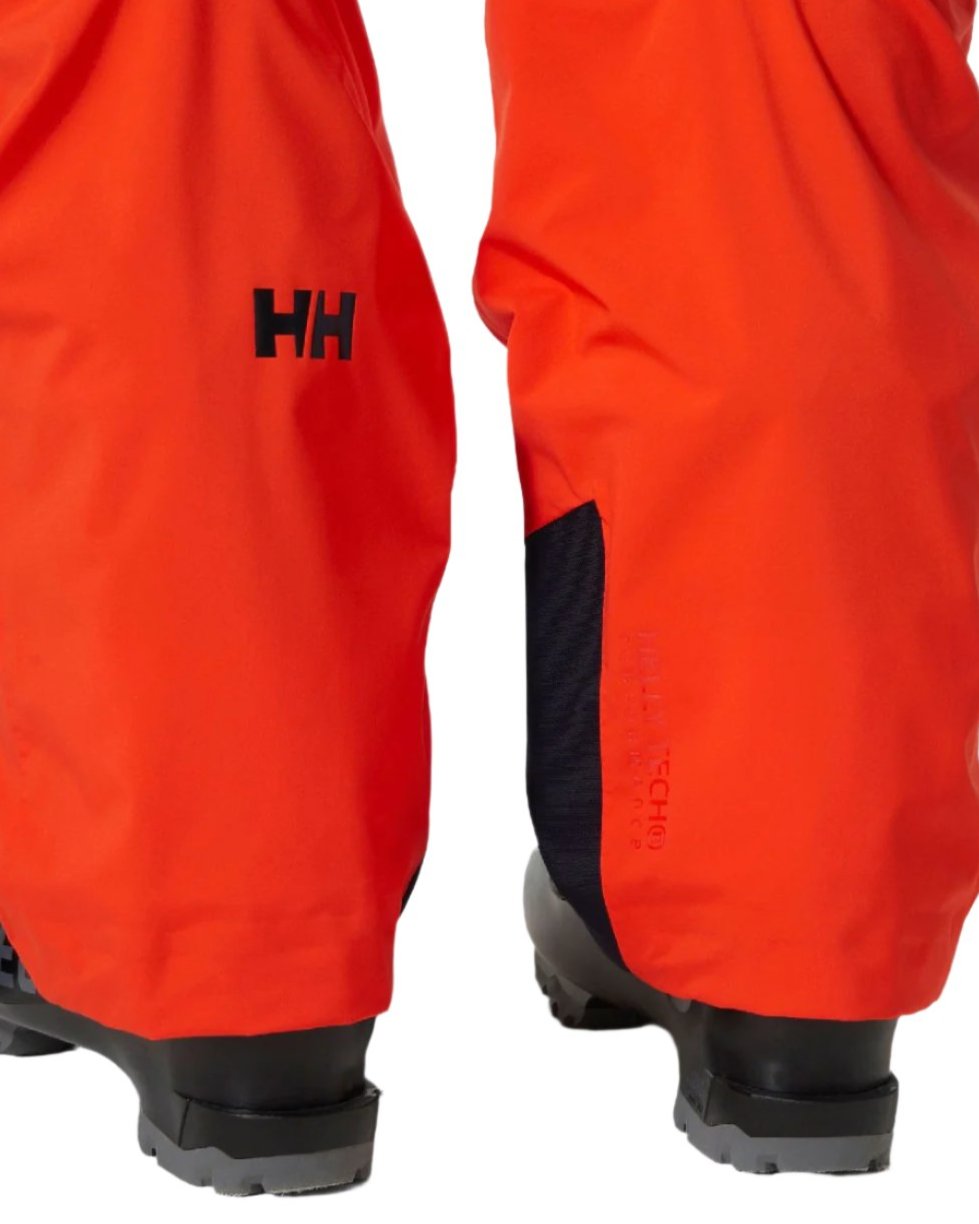 Cherry Tomato Coloured Helly Hansen Mens Legendary Insulated Ski Pants on white background 