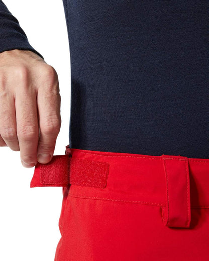 Red Coloured Helly Hansen Mens Legendary Insulated Ski Pants on white background 