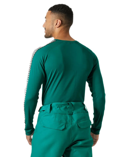 Signal Green Coloured Helly Hansen Mens Lifa Active Stripe Crew Base Layer on white background 