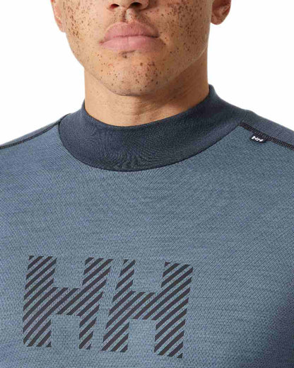 Washed Navy Coloured Helly Hansen Mens Lifa Merino Midweight Logo Base Layer on white background 