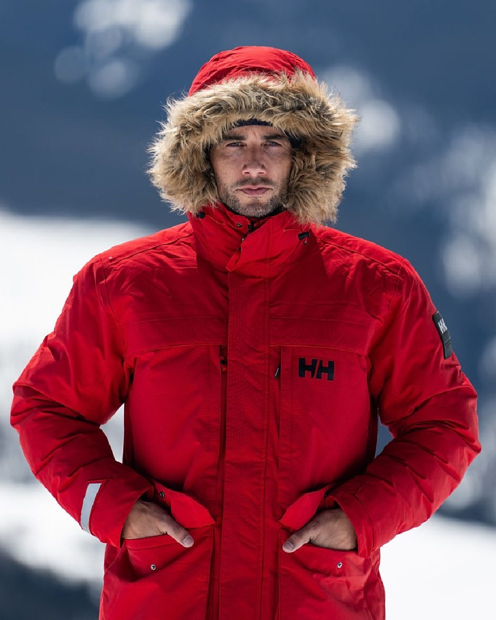 Red Coloured Helly Hansen Mens Nordsjo Winter Parka on sky background 