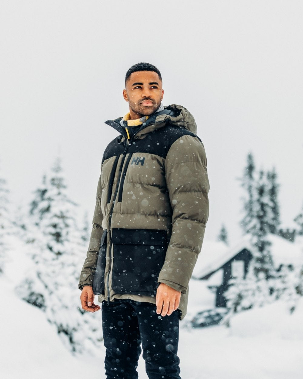 Utility Green Coloured Helly Hansen Mens Patrol Puffy Jacket on snow background 