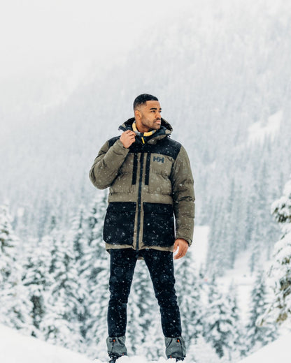 Utility Green Coloured Helly Hansen Mens Patrol Puffy Jacket on snow background 