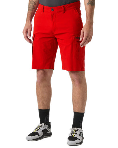 Red coloured Helly Hansen Mens Quick-Dry Cargo Shorts 11"on white background 