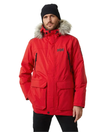 Red coloured Helly Hansen Mens Reine Winter Parka on white background 