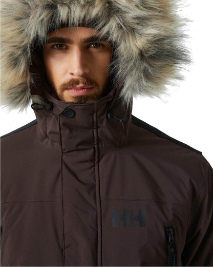 Triple Espresso coloured Helly Hansen Mens Reine Winter Parka on white background 