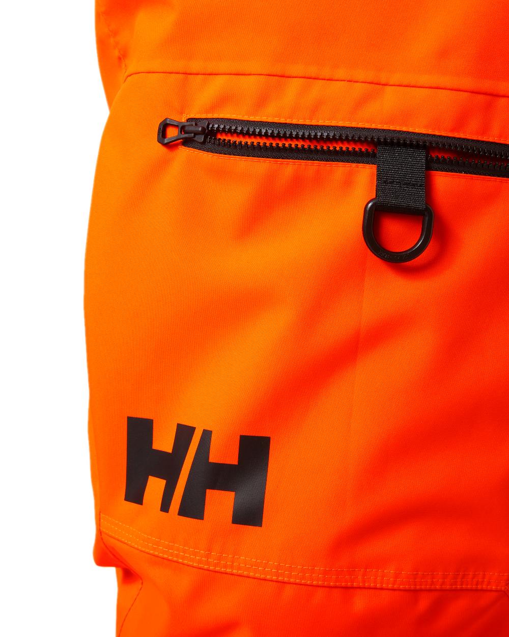 Neon Orange Coloured Helly Hansen Mens Sogn Cargo Pants on white background 