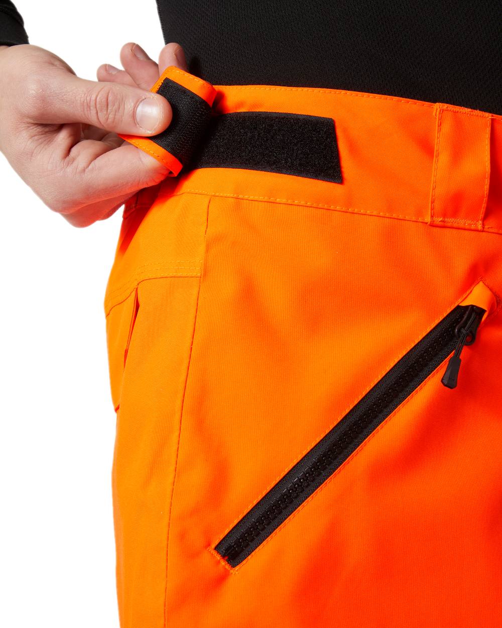 Neon Orange Coloured Helly Hansen Mens Sogn Cargo Pants on white background 