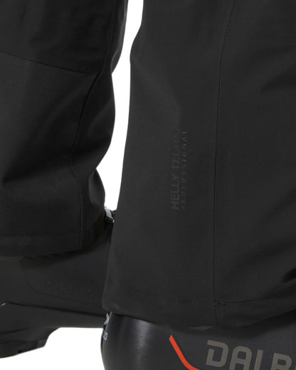 Black Coloured Helly Hansen Mens Swift 3 Layer Shell Pants on white background 