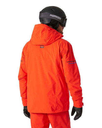 Cherry Tomato Coloured Helly Hansen Mens Swift Team Insulated Ski Jacket on white background 