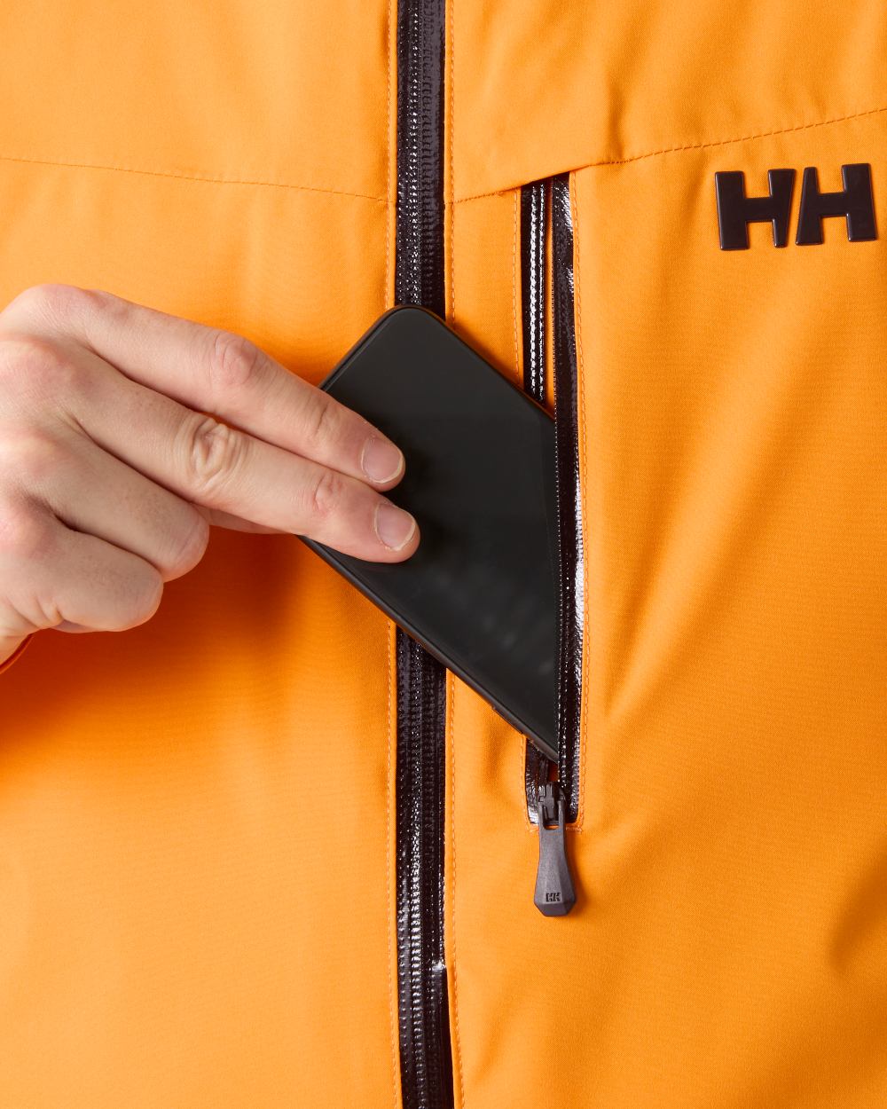 Ignite Orange Coloured Helly Hansen Mens Swift Team Insulated Ski Jacket on white background 