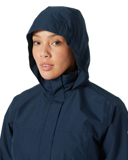 Navy coloured Helly Hansen Womens Aden Long Rain Coat on white background 