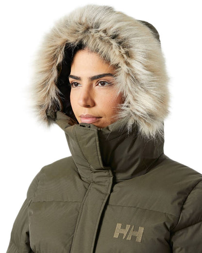 Utility Green Coloured Helly Hansen Womens Aria Long Parka on white background 
