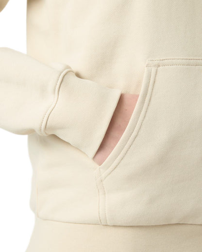 Cream coloured Helly Hansen Womens Core Graphic Hoodie on white background 