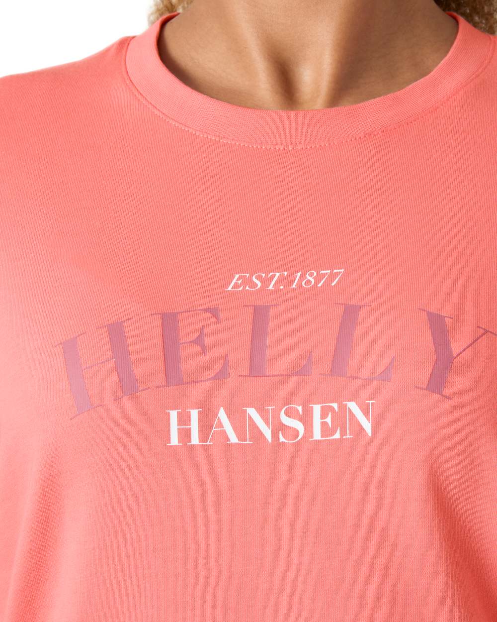 Coral Almond coloured Helly Hansen Womens Core Graphic T-Shirt 2.0 on white background 