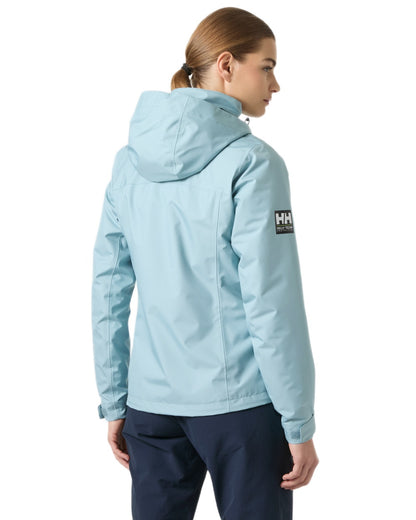 Windy Blue Coloured Helly Hansen Womens Crew Hooded Midlayer Sailing Jacket 2.0 On A White Background 