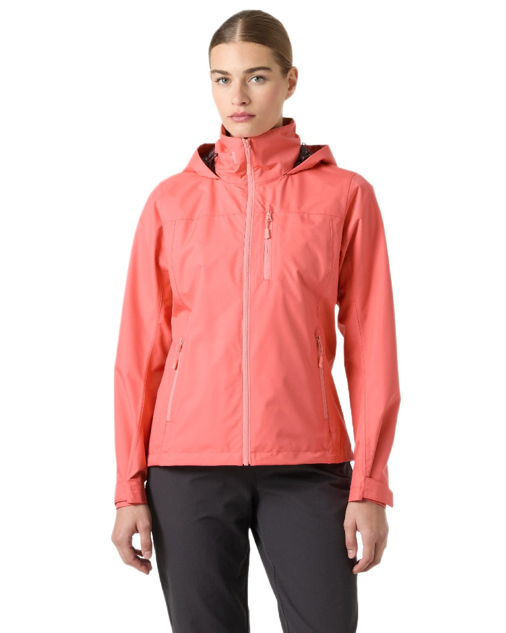 Sunset Pink Coloured Helly Hansen womens crew hooded sailing jacket 2.0 on white background 