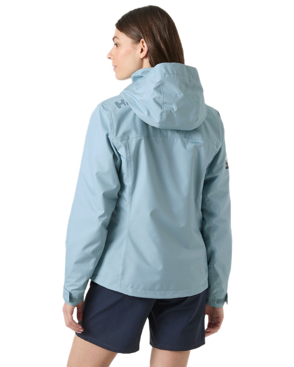 Windy Blue Coloured Helly Hansen womens crew hooded sailing jacket 2.0 on white background 