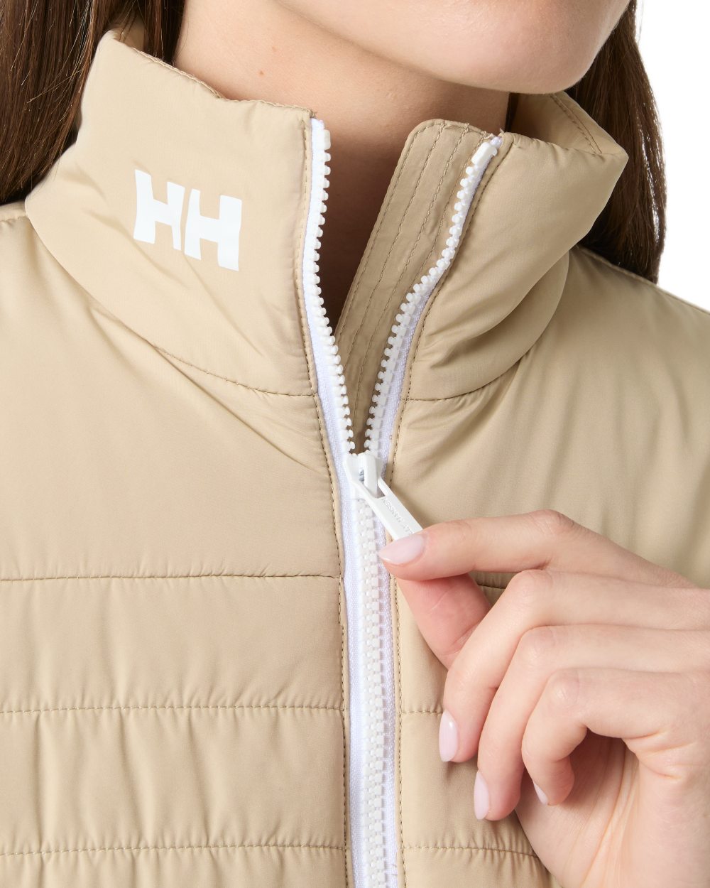 Khaki coloured Helly Hansen Womens Crew Insulated Sailing Jacket 2.0 on white background 