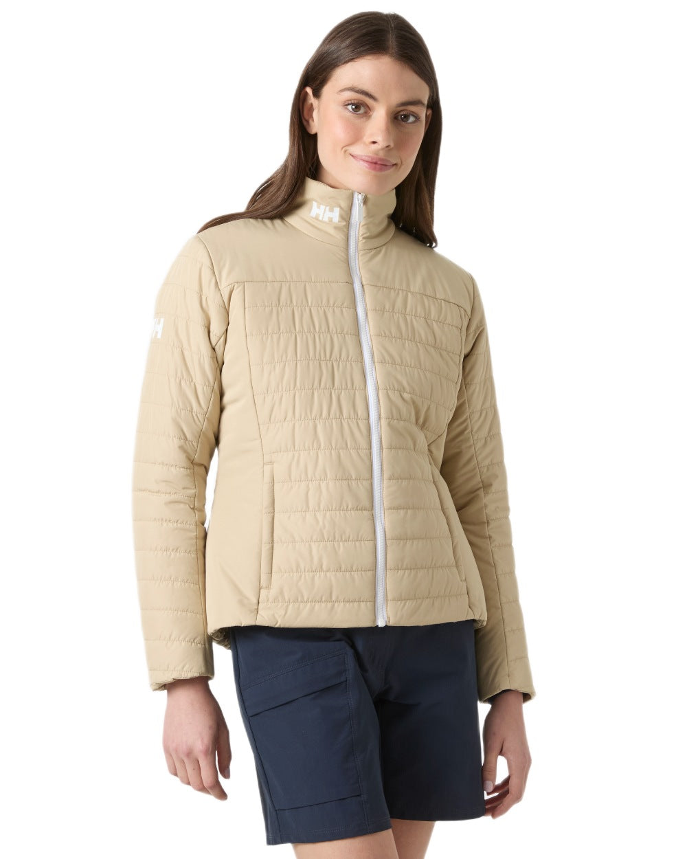 Khaki coloured Helly Hansen Womens Crew Insulated Sailing Jacket 2.0 on white background 