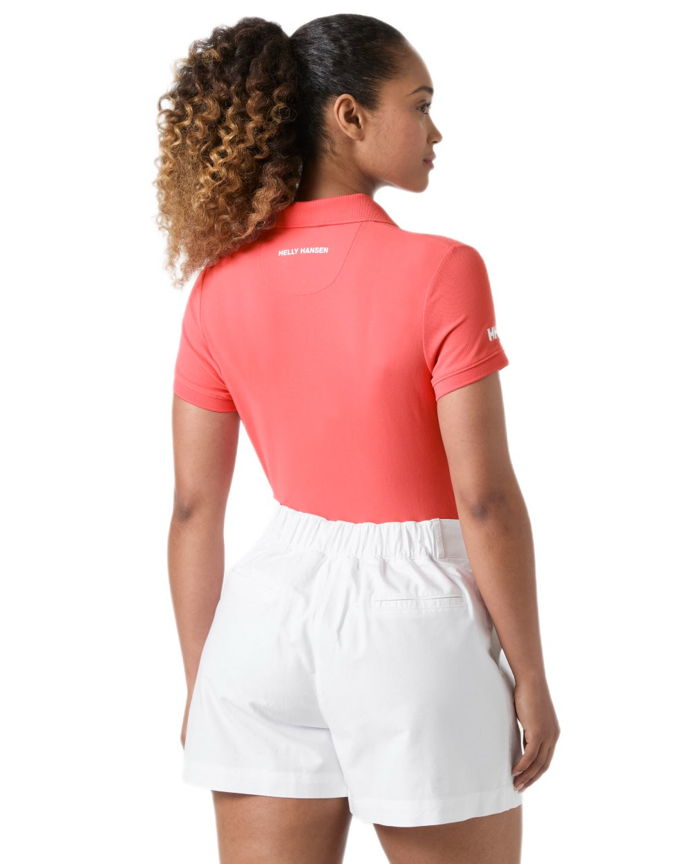 Sunset Pink coloured Helly Hansen Womens Crewline Polo on White background 