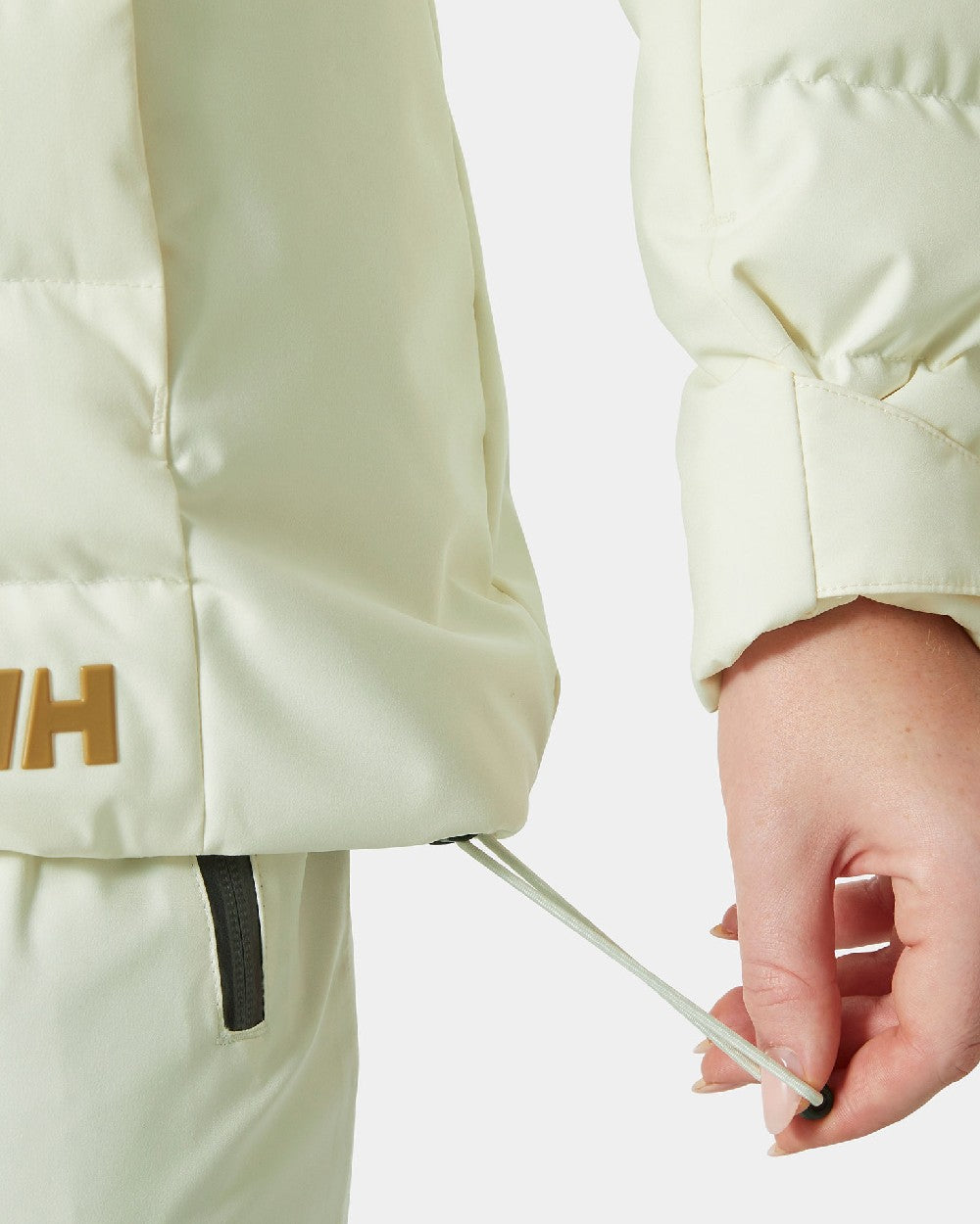 Gold Snow Coloured Helly Hansen Womens Imperial Puffy Jacket on white background 