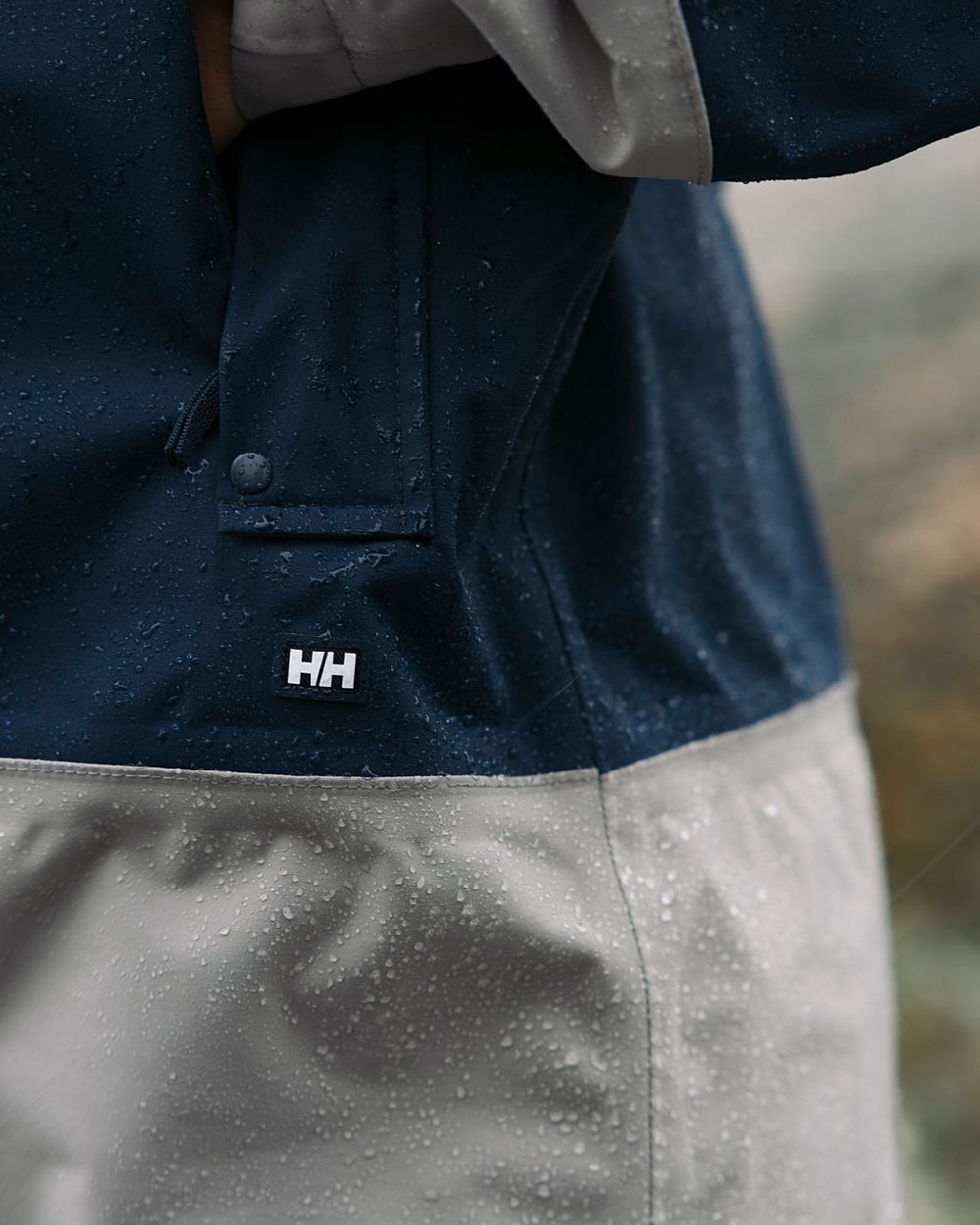 White coloured Helly Hansen Womens Koster Raincoat on blurry background 