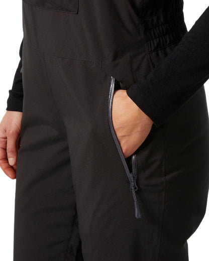 Black Coloured Helly Hansen Womens Legendary Insulated Bib Pants on white background 