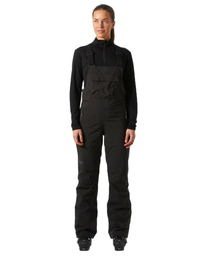 Black Coloured Helly Hansen Womens Legendary Insulated Bib Pants on white background 