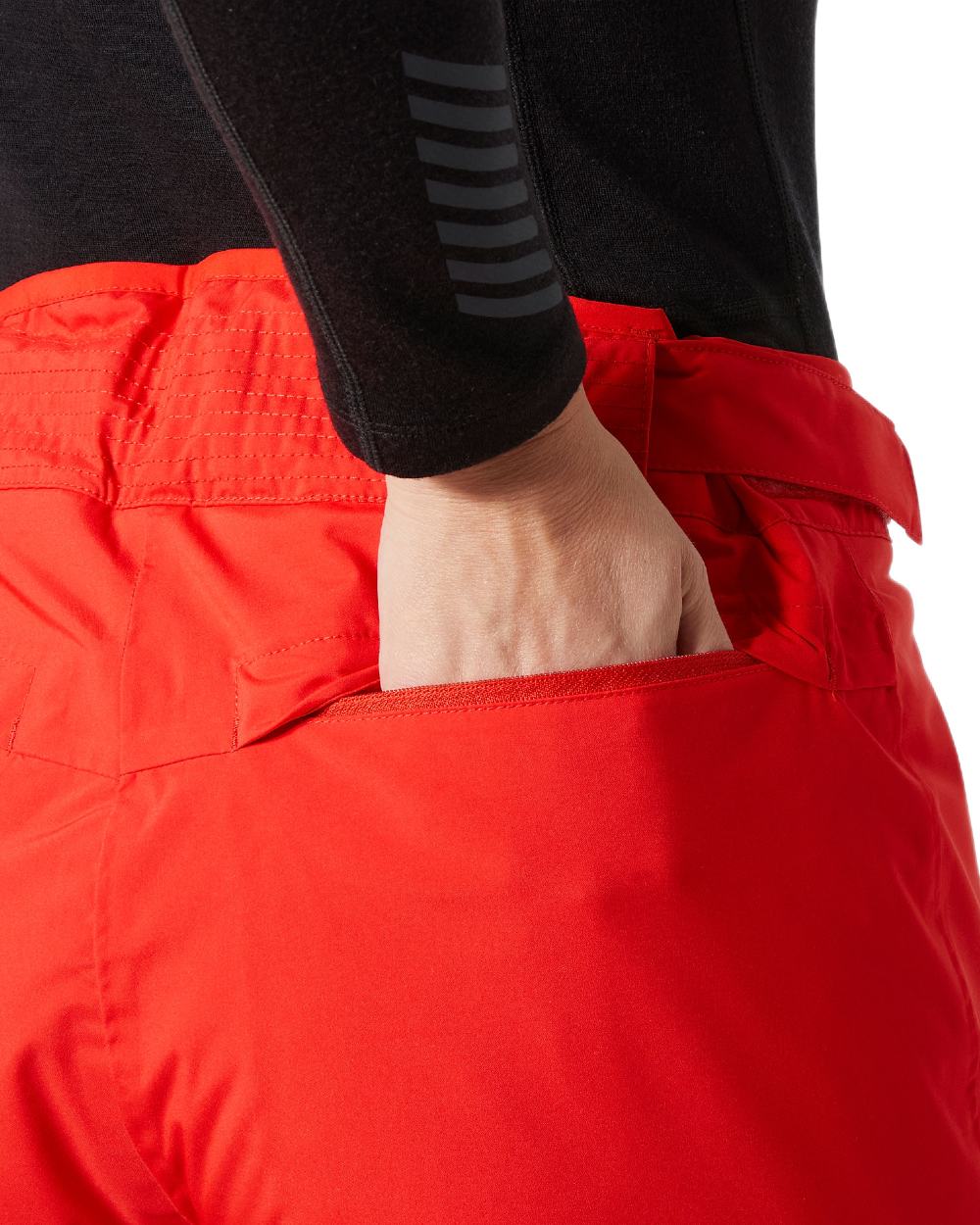Alert Red Coloured Helly Hansen Womens Legendary Insulated Ski Pants on white background 