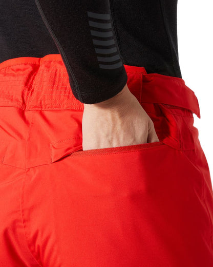 Alert Red Coloured Helly Hansen Womens Legendary Insulated Ski Pants on white background 