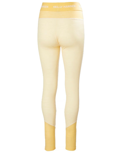 Yellow Cream Coloured Helly Hansen Womens Lifa Merino Midweight 2-In-1 Base Layer Pants on white background 