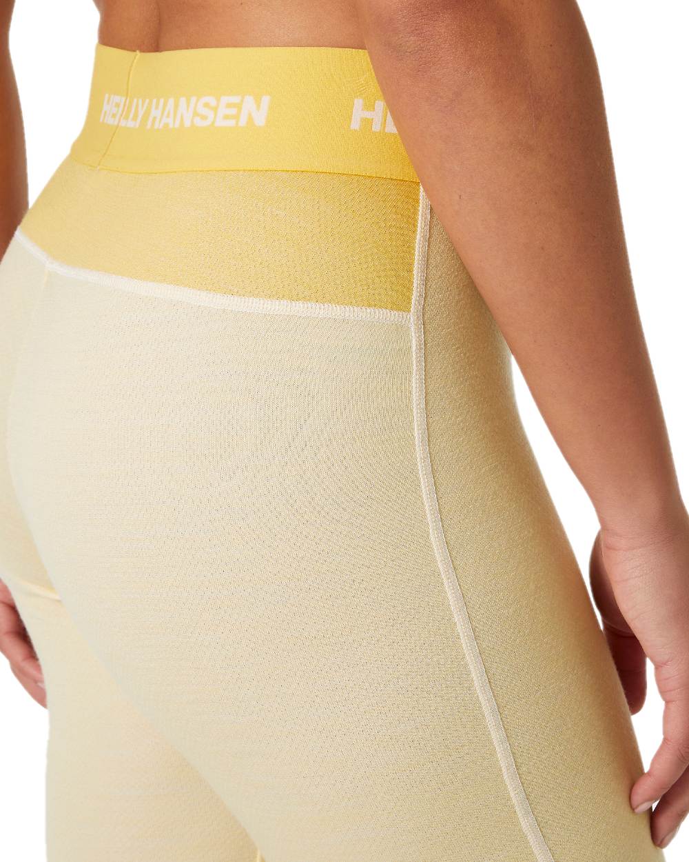 Yellow Cream Coloured Helly Hansen Womens Lifa Merino Midweight 2-In-1 Base Layer Pants on white background 