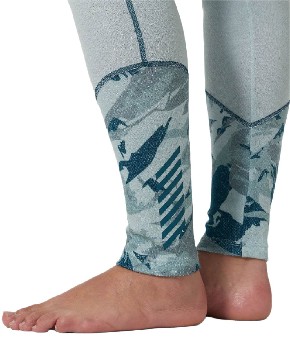 Green Mist Mountain Camo A Coloured Helly Hansen Womens Lifa Merino Midweight Graphic Base Layer Pants on white background 