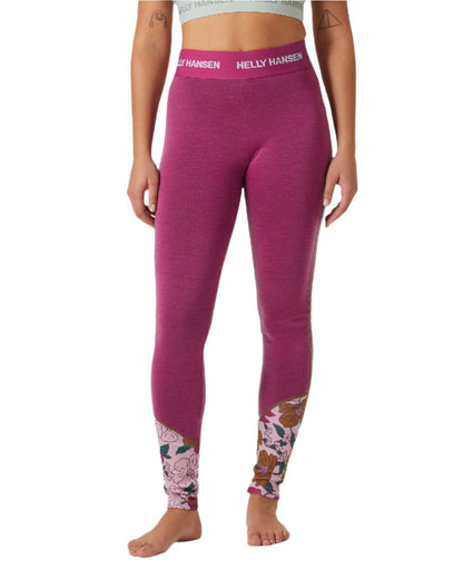 Magenta 2 Floral Aop Coloured Helly Hansen Womens Lifa Merino Midweight Graphic Base Layer Pants on white background 