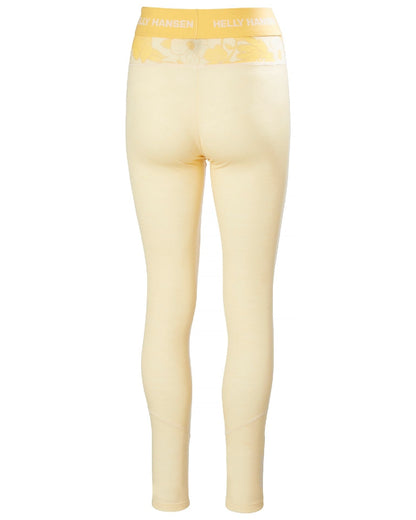 Yellow Cream Floral Aop Coloured Helly Hansen Womens Lifa Merino Midweight Graphic Base Layer Pants on white background 