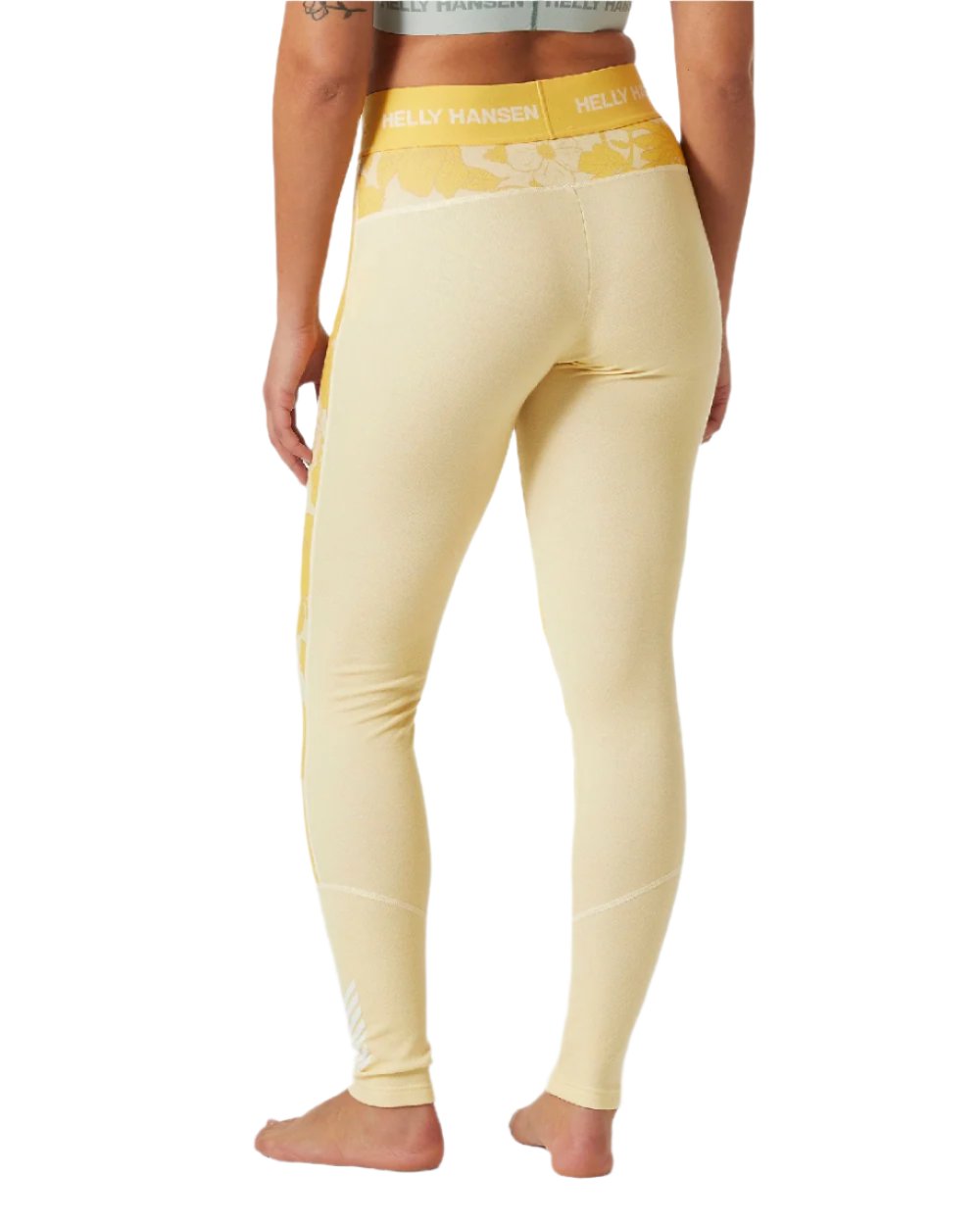 Yellow Cream Floral Aop Coloured Helly Hansen Womens Lifa Merino Midweight Graphic Base Layer Pants on white background 