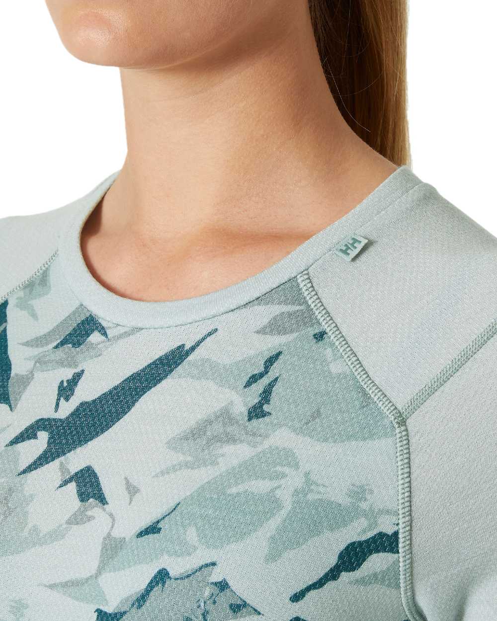 Green Mist Mountain Camo Coloured Helly Hansen Womens Lifa Merino Midweight Graphic Long Sleeve Crew Base Layer on white background 