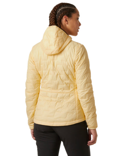 Yellow Cream Coloured Helly Hansen Womens Lifaloft Hooded Insulated Jacket on white background 