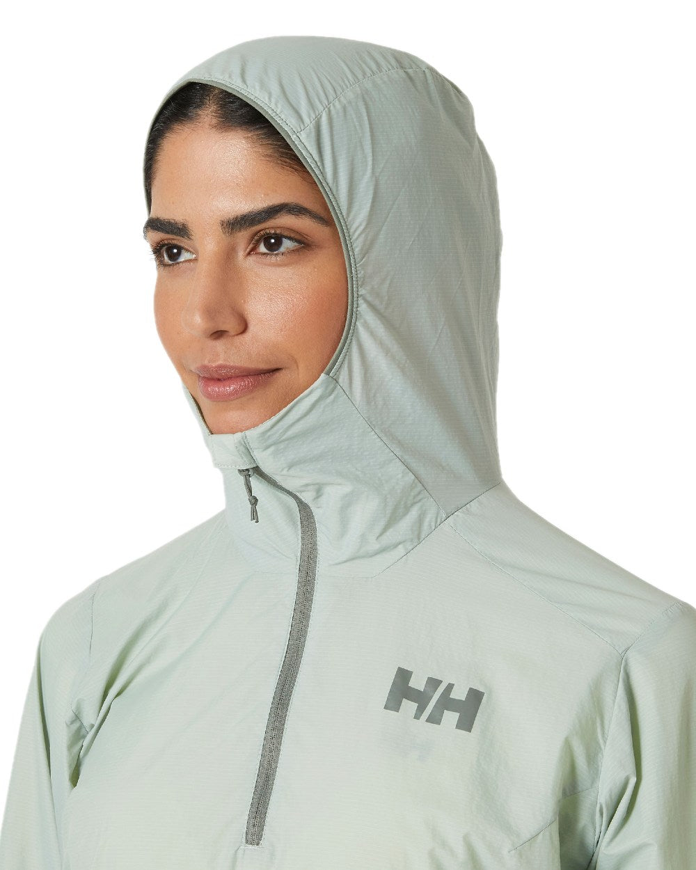 Green Mist coloured Helly Hansen Womens Roam Wind Anorak on white background 