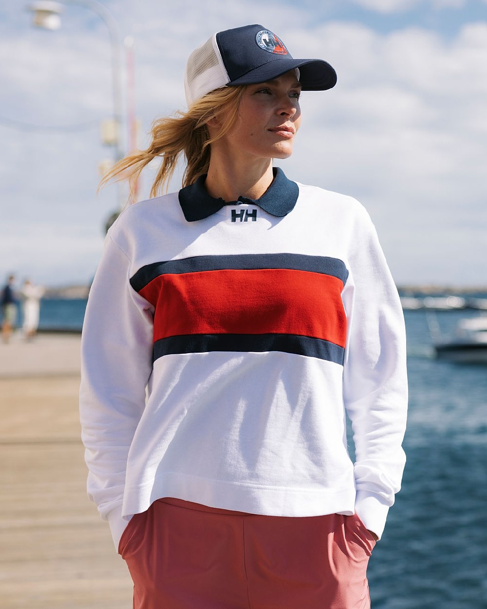 White coloured Helly Hansen Womens Salt Crew Sweatshirt on blurry background 