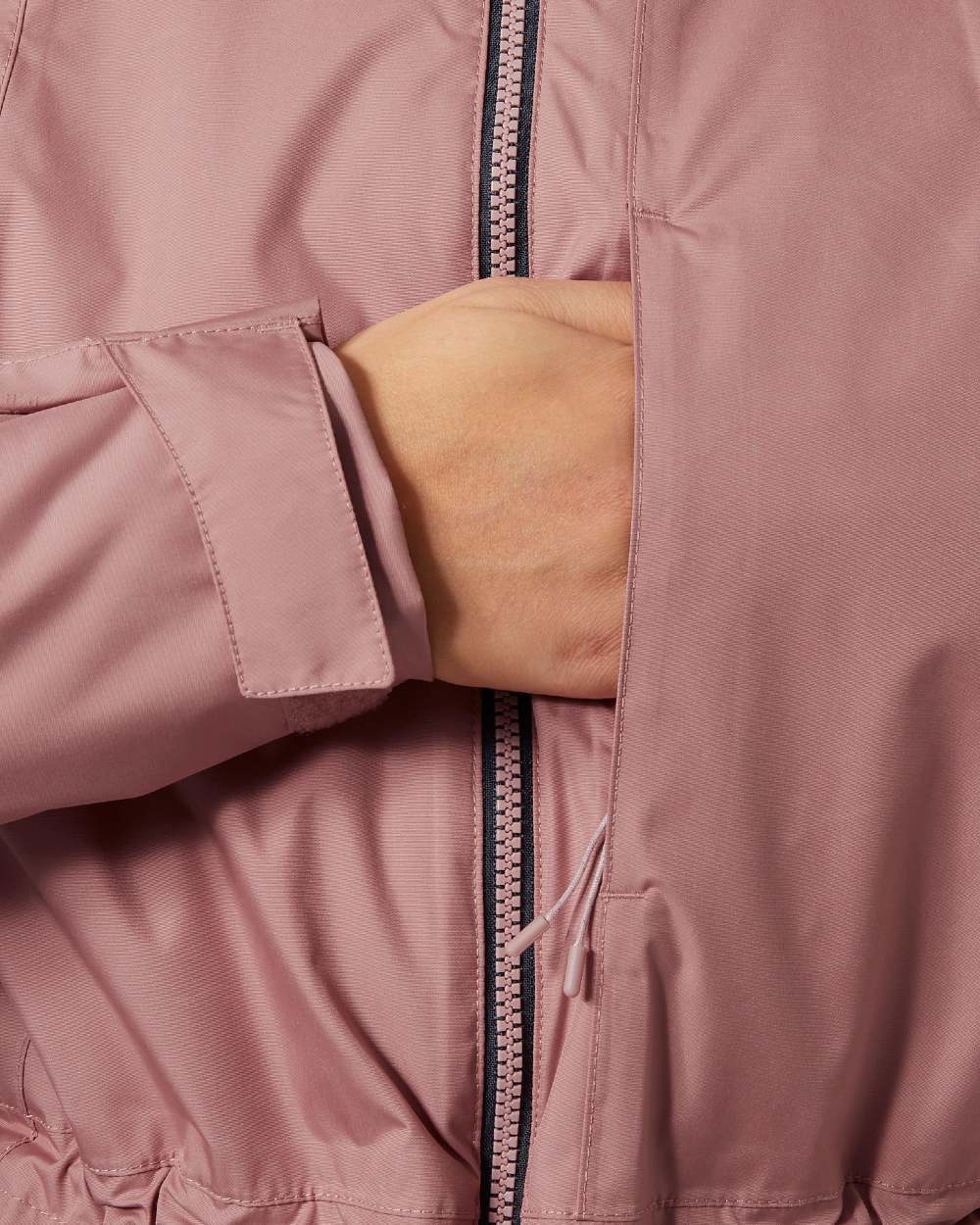 Ash Rose Coloured Helly Hansen Womens Westport Insulated Coat on white background 