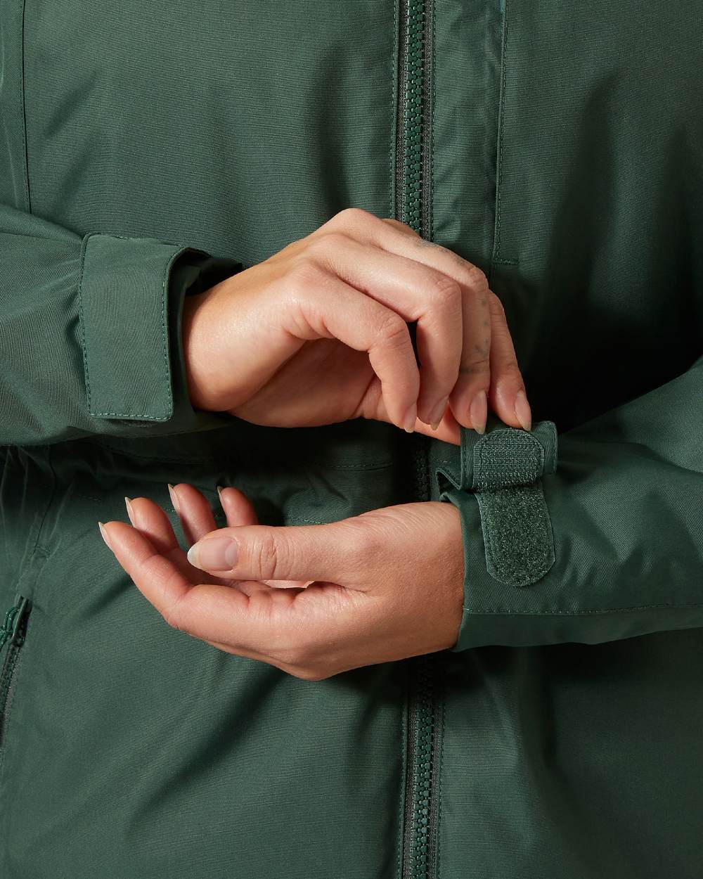 Jungle Green Coloured Helly Hansen Womens Westport Insulated Coat on white background 