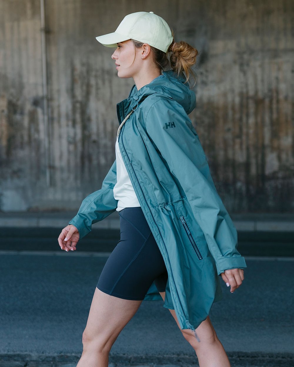 Grey Cactus coloured Helly Hansen Womens Westport Raincoat on street background 