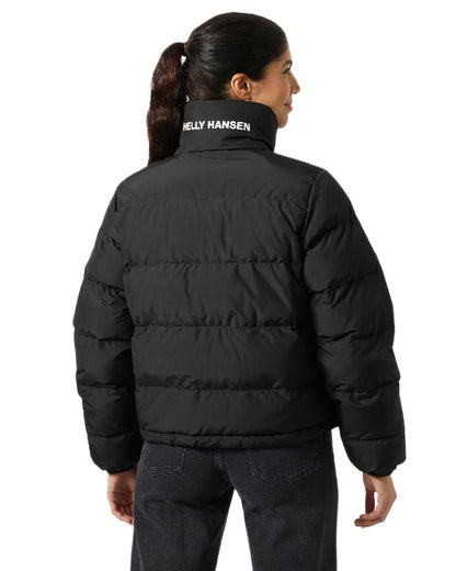 Black Coloured Helly Hansen Womens YU 23 Reversible Puffer Jacket on white background 