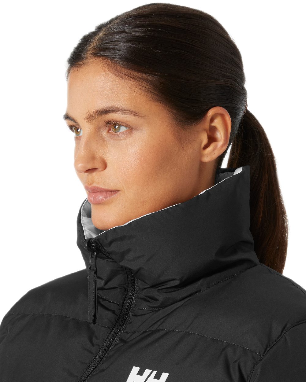 Black Coloured Helly Hansen Womens YU 23 Reversible Puffer Jacket on white background 